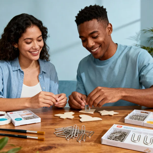 Lifestyle hero image with metal u pins, brushes, and craft kit on wooden table